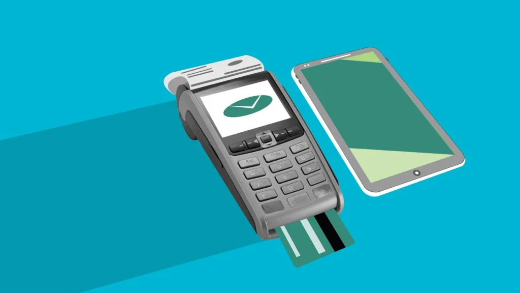 Terminal de pagos y teléfono móvil representando servicios fintech